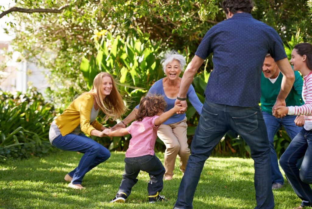 Parents and grandparents playing energetically with kids after undergoing Weight Loss in Wellen Park