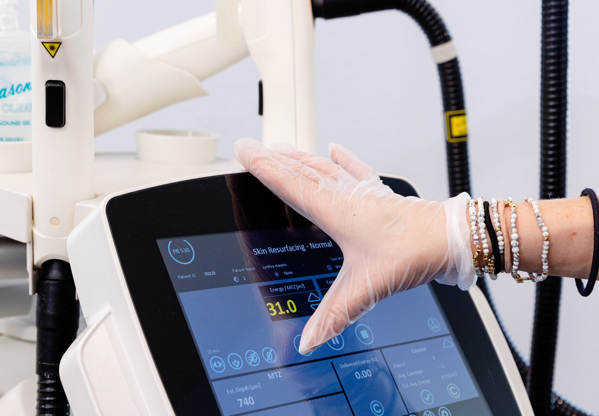 A provider using skin resurfacing touch screen base during treatment for Laser Skin Resurfacing in Venice, FL
