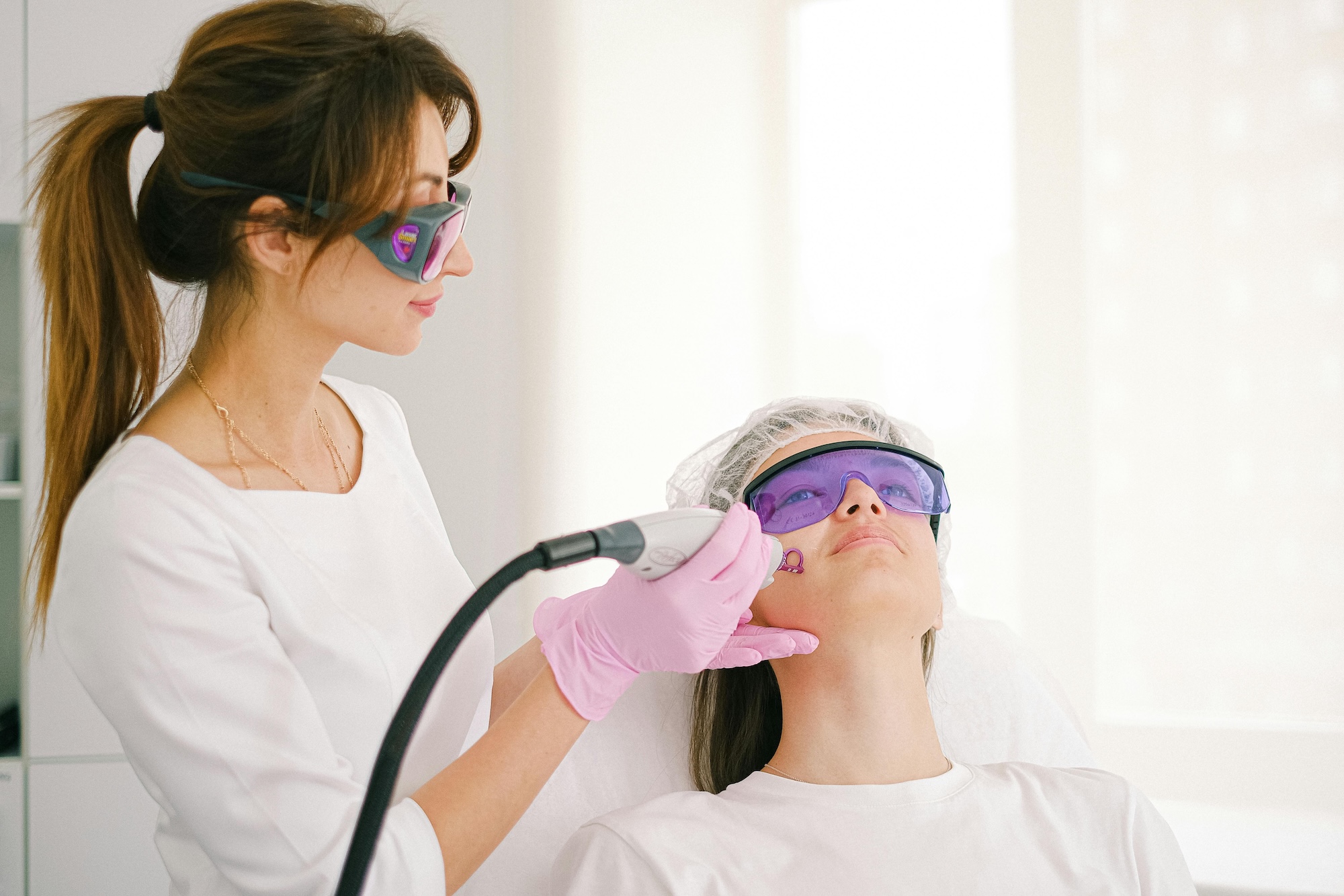 Provider performing procedure to patient's face for Laser Skin Resurfacing in Venice, FL