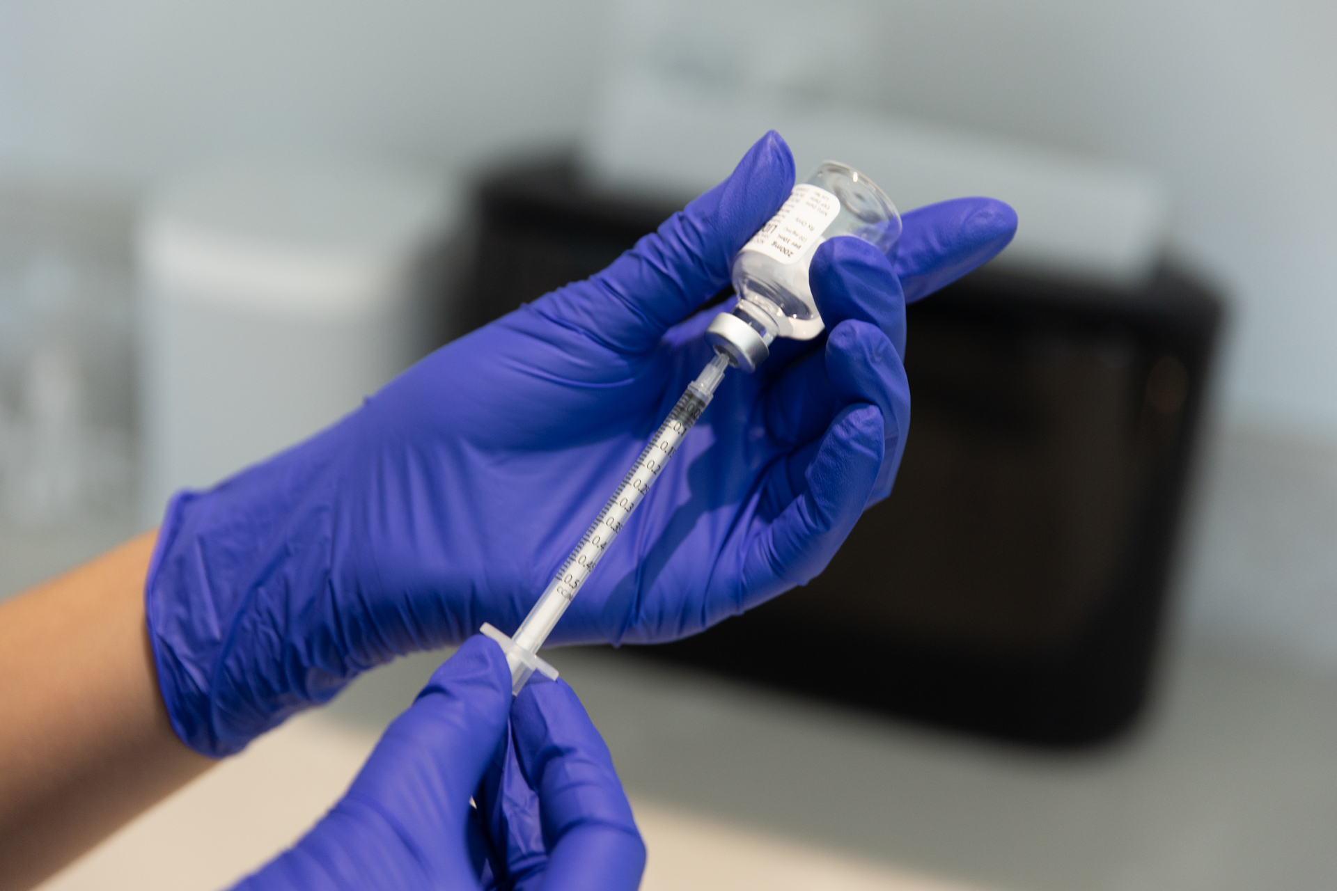 A close-up of a provider holding a syringe and a vial of Botox near Myakka City.